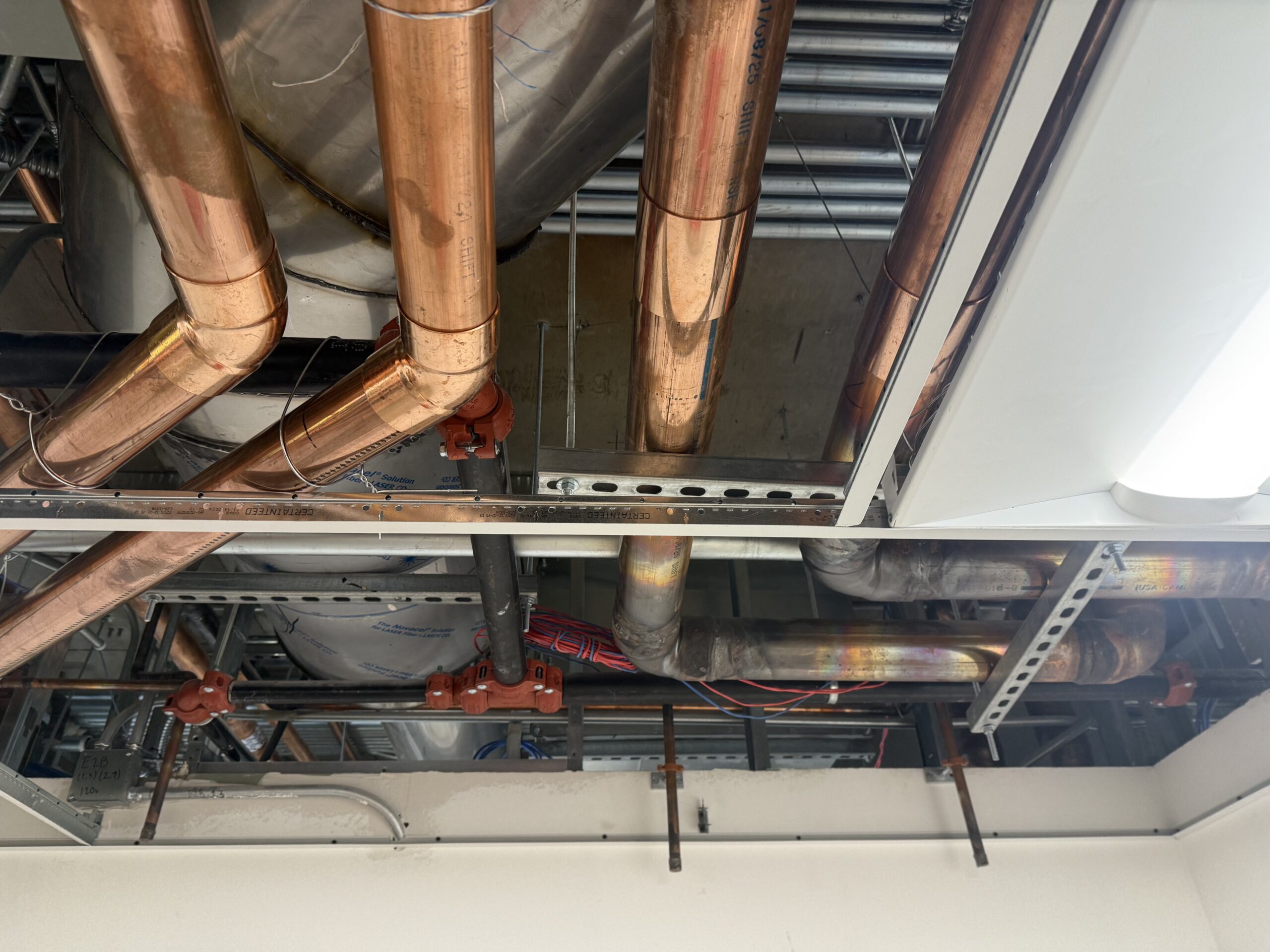Commercial mechanical piping installation inside an existing occupied facility