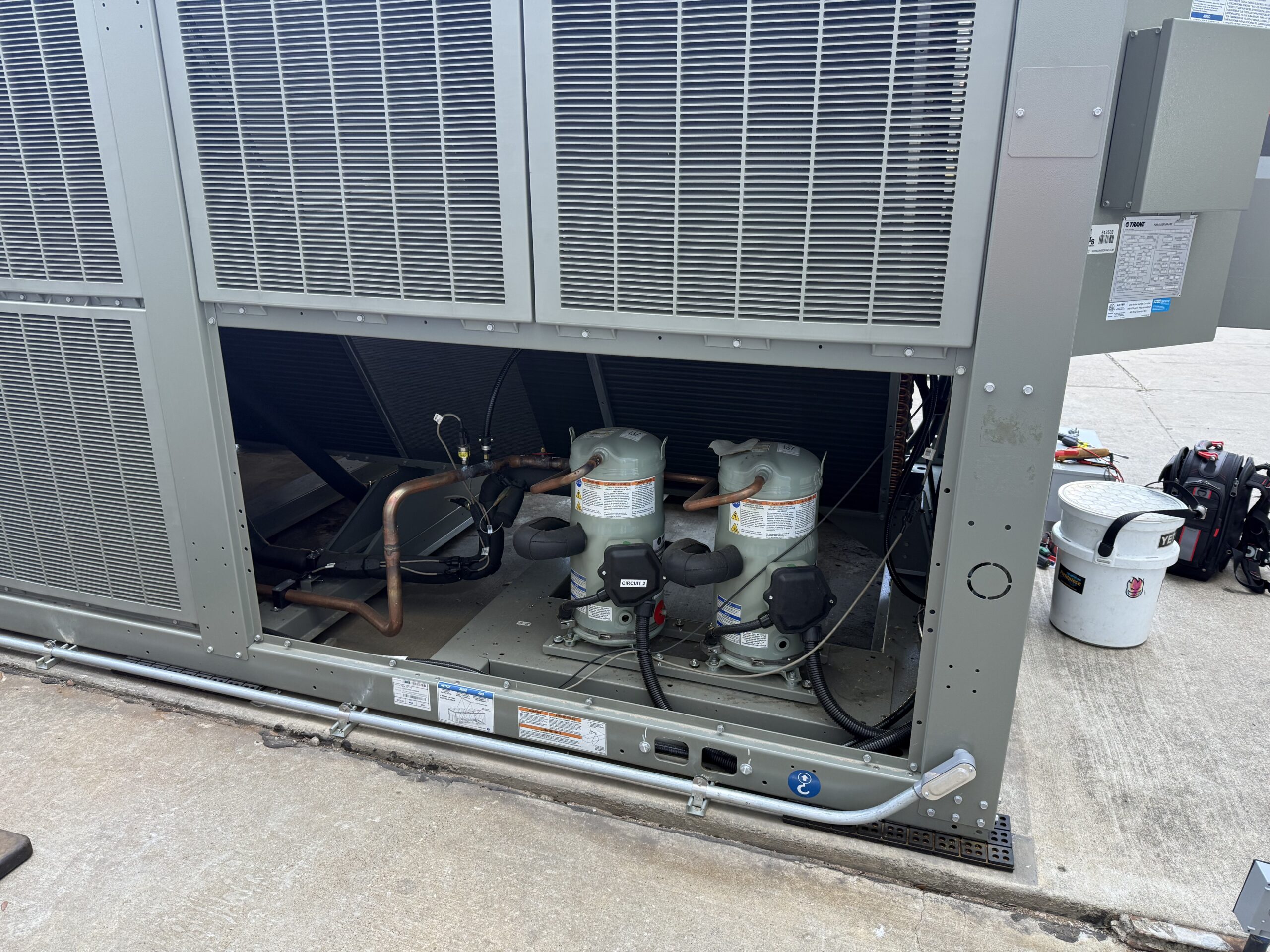 Commercial rooftop HVAC equipment with service components exposed