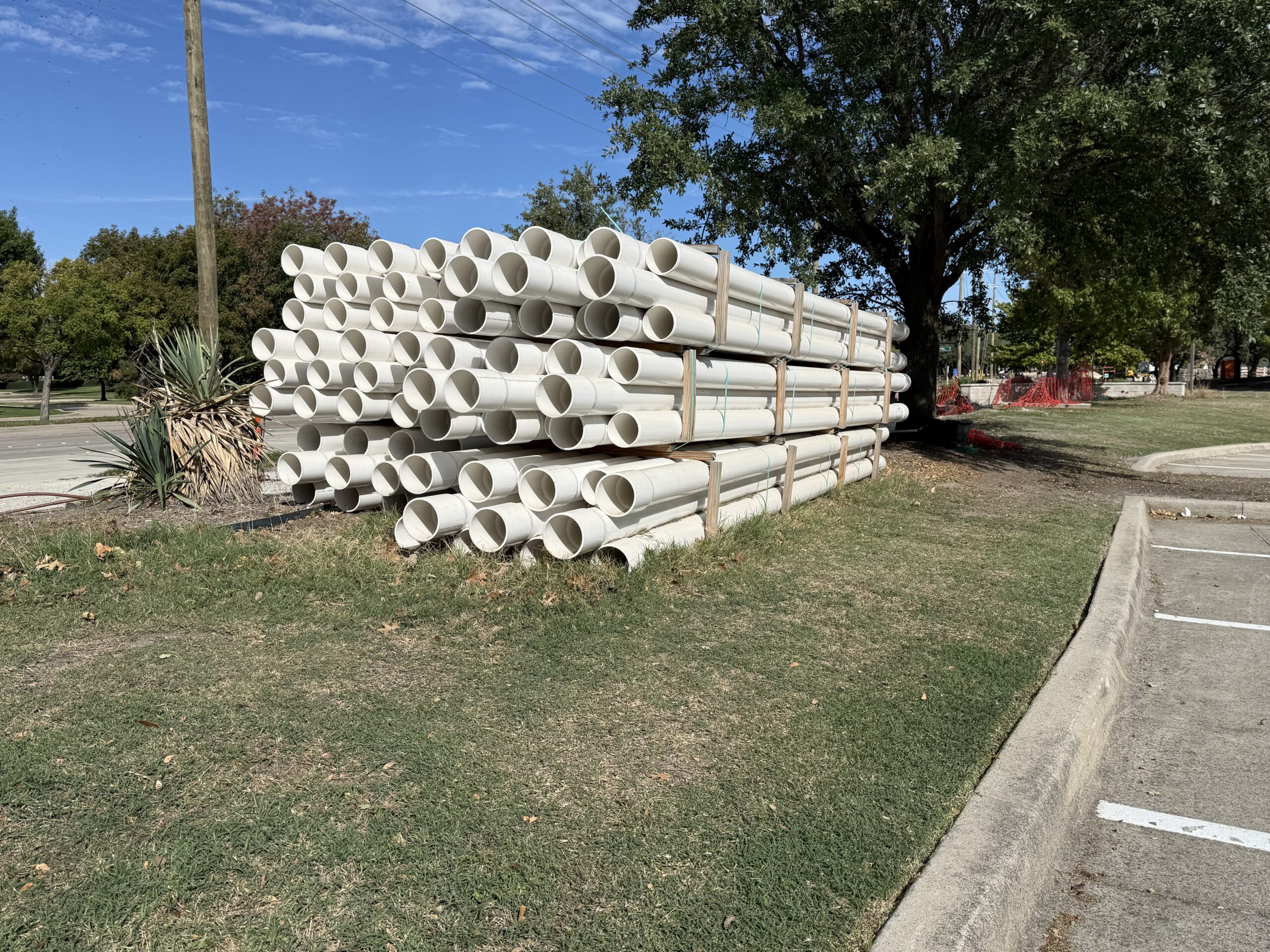 Large-diameter plastic piping staged for water infrastructure construction